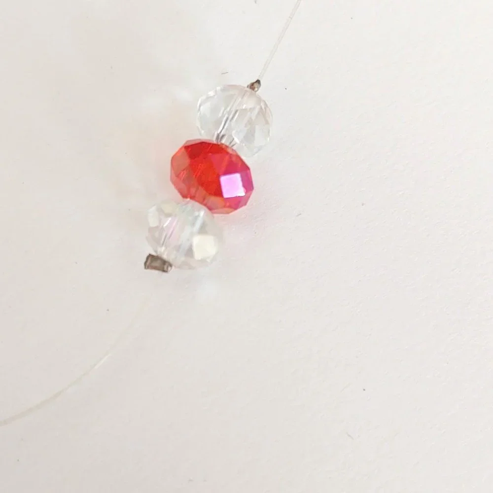 Floating clear and orange crystal necklace
